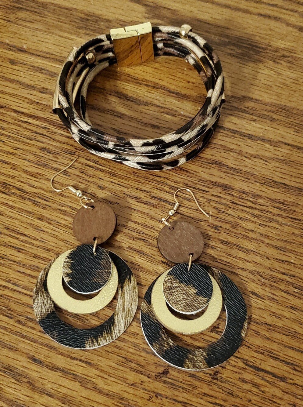 ANIMAL PRINT FAUX LEATHER CUFF BRACELET AND MATCHING TIERED DANGLE EARRINGS